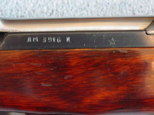 Does your rifle have a small star on the left side of the receiver a few inches behind the serial number like the photos below?